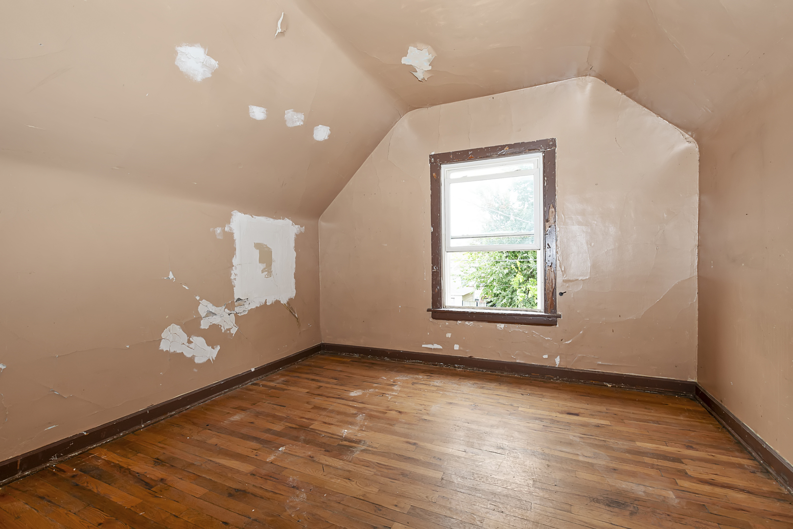 4821 West Hirsch Street Chicago, IL 60651 - Photo 18 of 23 an empty room with wooden floor and windows
