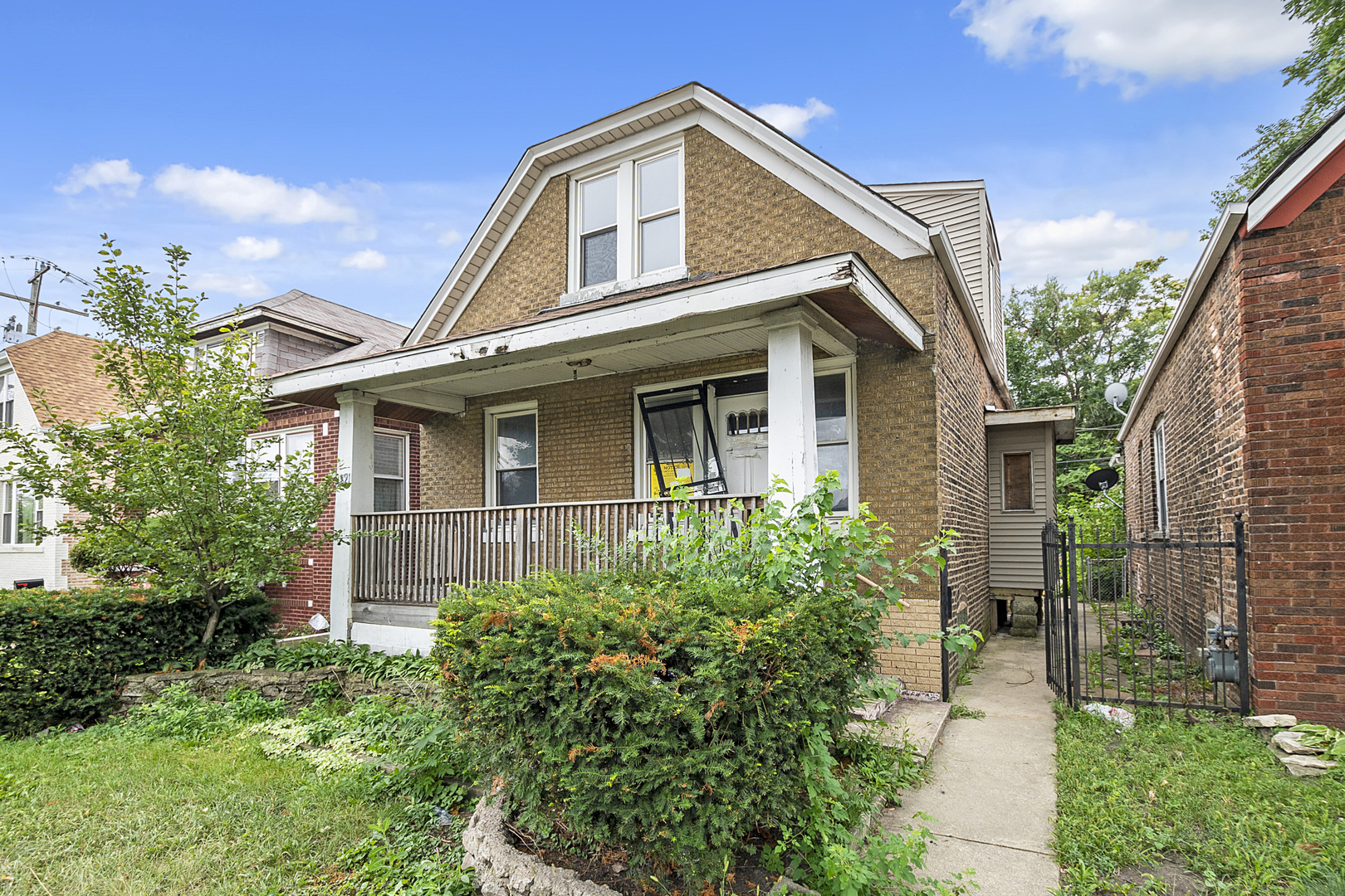 4821 West Hirsch Street Chicago, IL 60651 - Photo 2 of 23 a front view of a house with garden