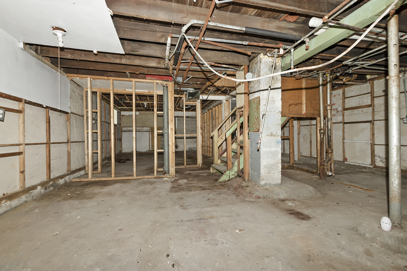 4821 West Hirsch Street Chicago, IL 60651 - Photo 22 of 23 a view of an empty room with wooden walls