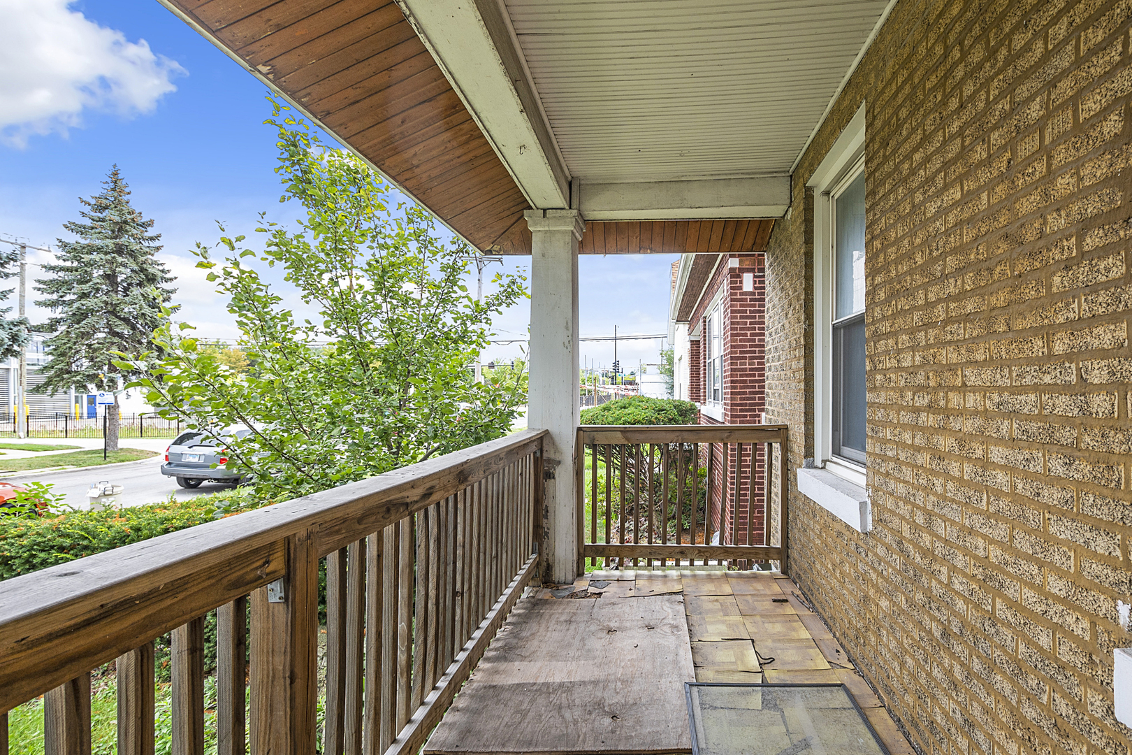 4821 West Hirsch Street Chicago, IL 60651 - Photo 4 of 23 a view of a balcony with wooden floor