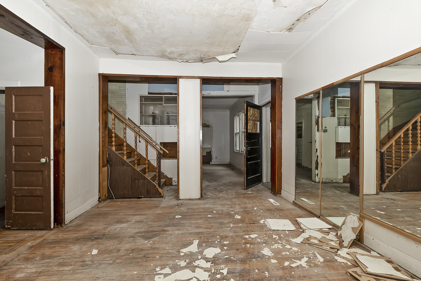 4821 West Hirsch Street Chicago, IL 60651 - Photo 6 of 23 a view of a hallway with wooden walls and entryway
