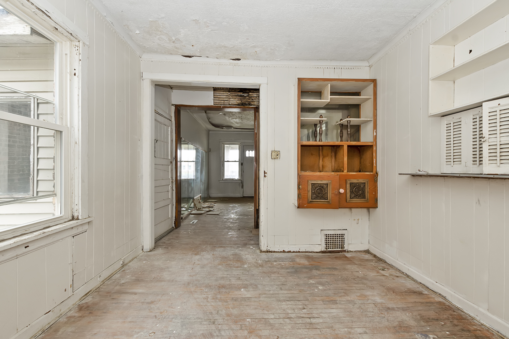 4821 West Hirsch Street Chicago, IL 60651 - Photo 10 of 23 wooden floor and windows in a room