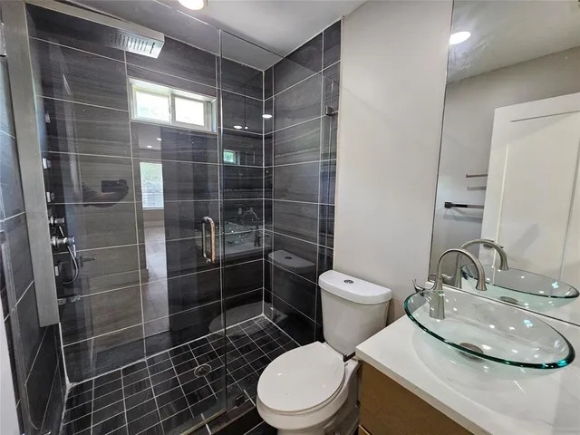a bathroom with a toilet and a sink