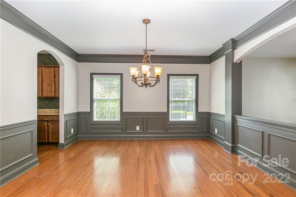1000 Ridgehaven Road Waxhaw, NC 28173 - Photo 11 of 22 a view of an entryway with wooden floor and cabinet