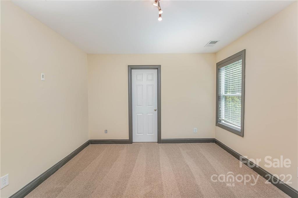 1000 Ridgehaven Road Waxhaw, NC 28173 - Photo 19 of 22 an empty room with windows
