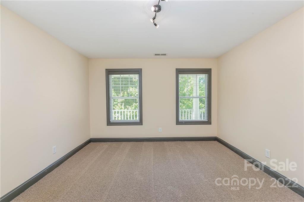 1000 Ridgehaven Road Waxhaw, NC 28173 - Photo 21 of 22 an empty room with windows