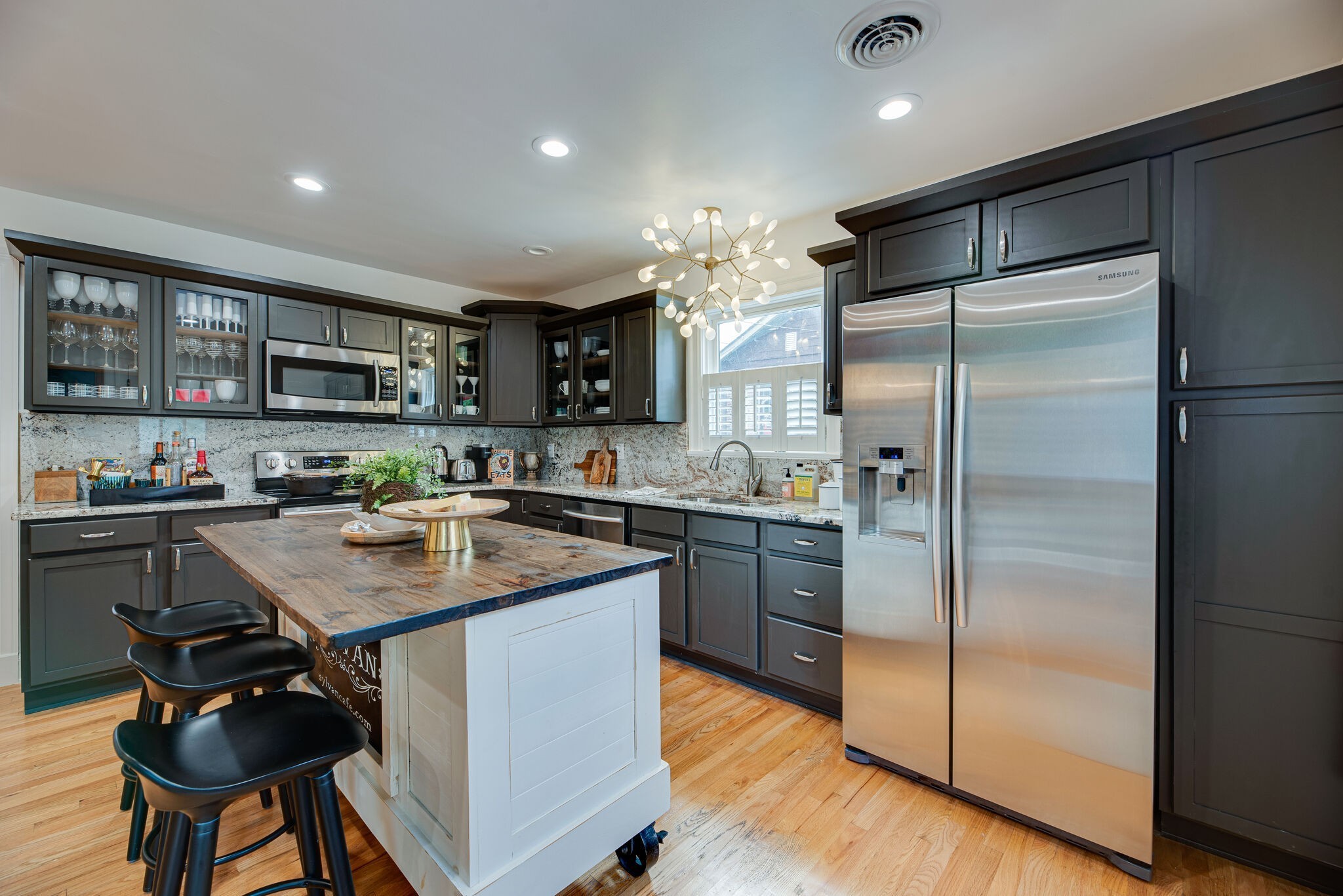 1715 Holly Street Nashville, TN 37206 - Photo 14 of 54 a kitchen with kitchen island a counter top space cabinets and stainless steel appliances