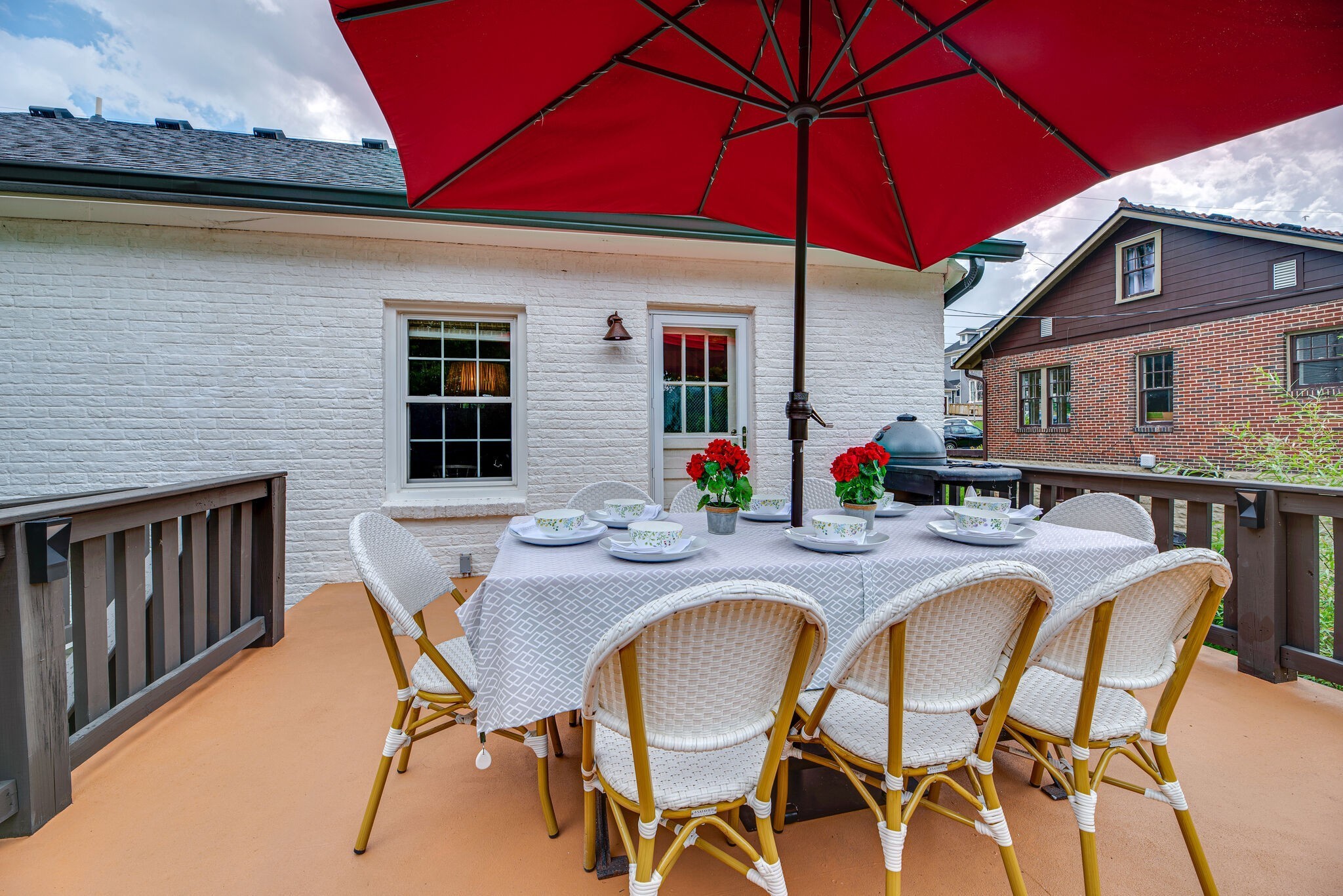 1715 Holly Street Nashville, TN 37206 - Photo 18 of 54 a dinning table and chairs under an umbrella