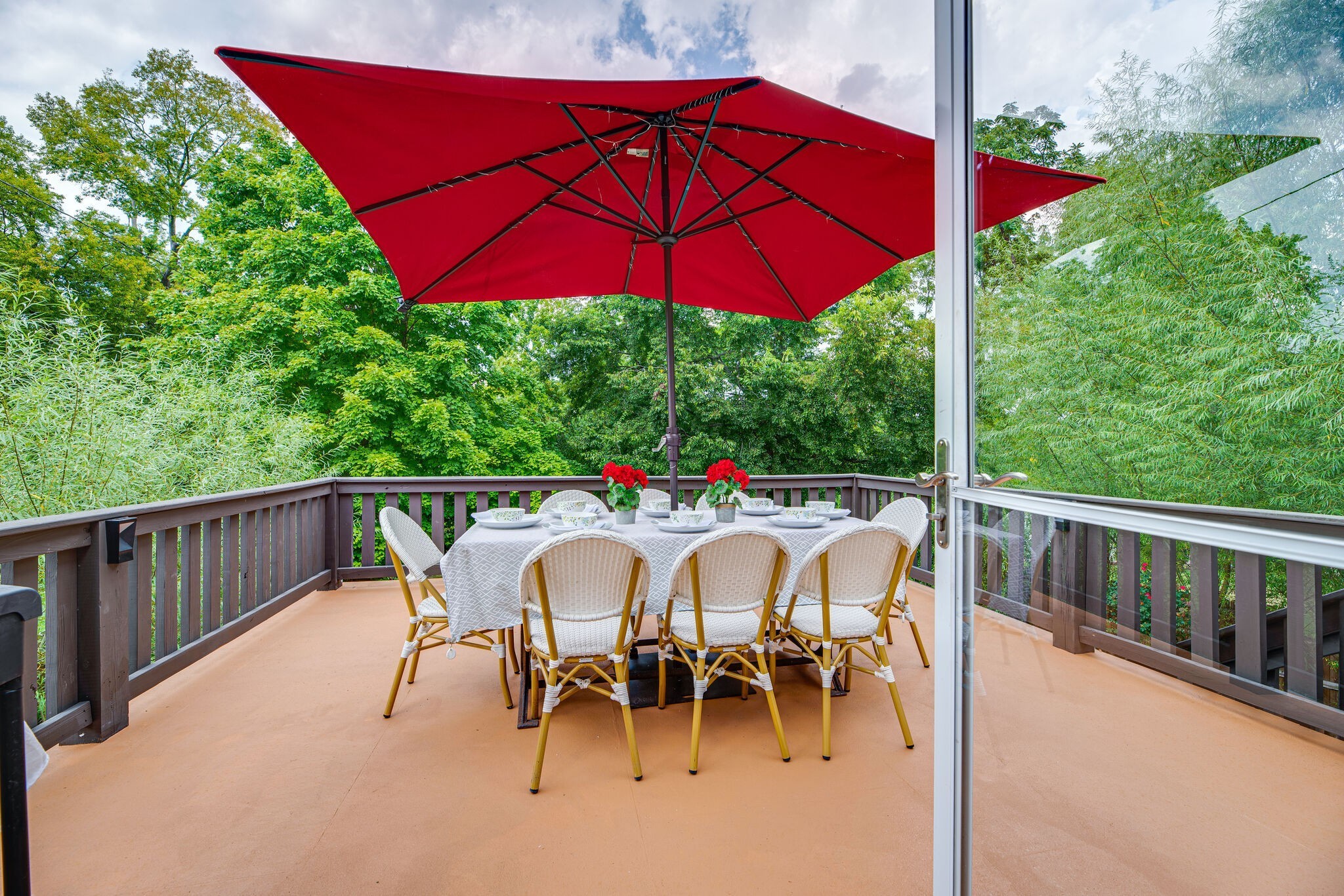 1715 Holly Street Nashville, TN 37206 - Photo 20 of 54 a view of a patio with a table and chairs under an umbrella