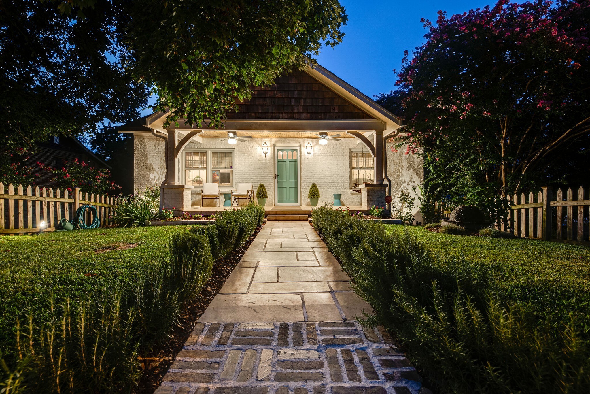 1715 Holly Street Nashville, TN 37206 - Photo 2 of 54 a view of a pathway with a wrought fence