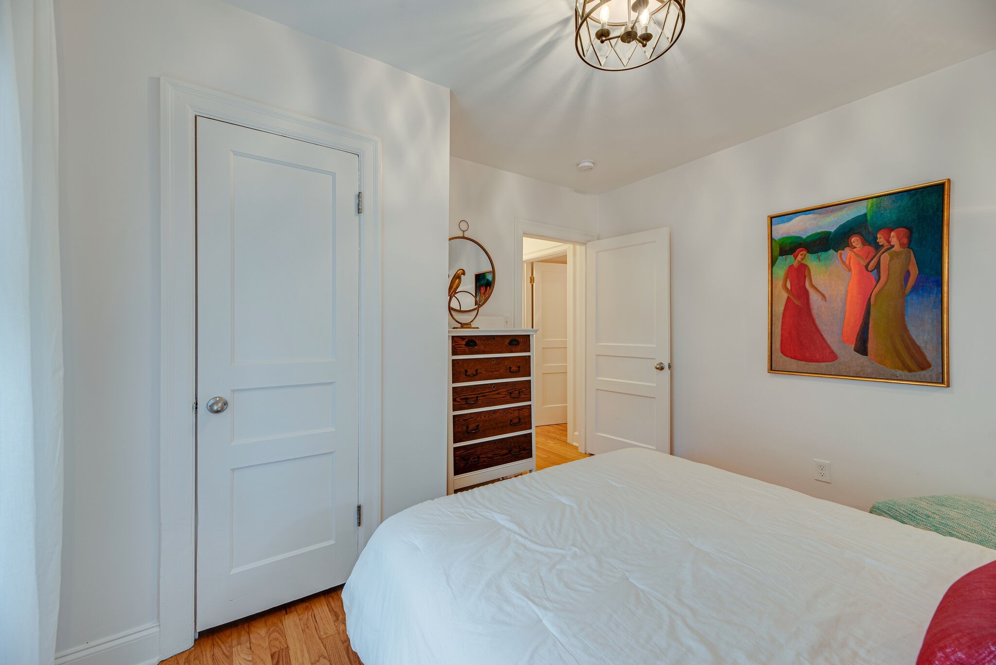 1715 Holly Street Nashville, TN 37206 - Photo 25 of 54 a bedroom with a bed and a chandelier