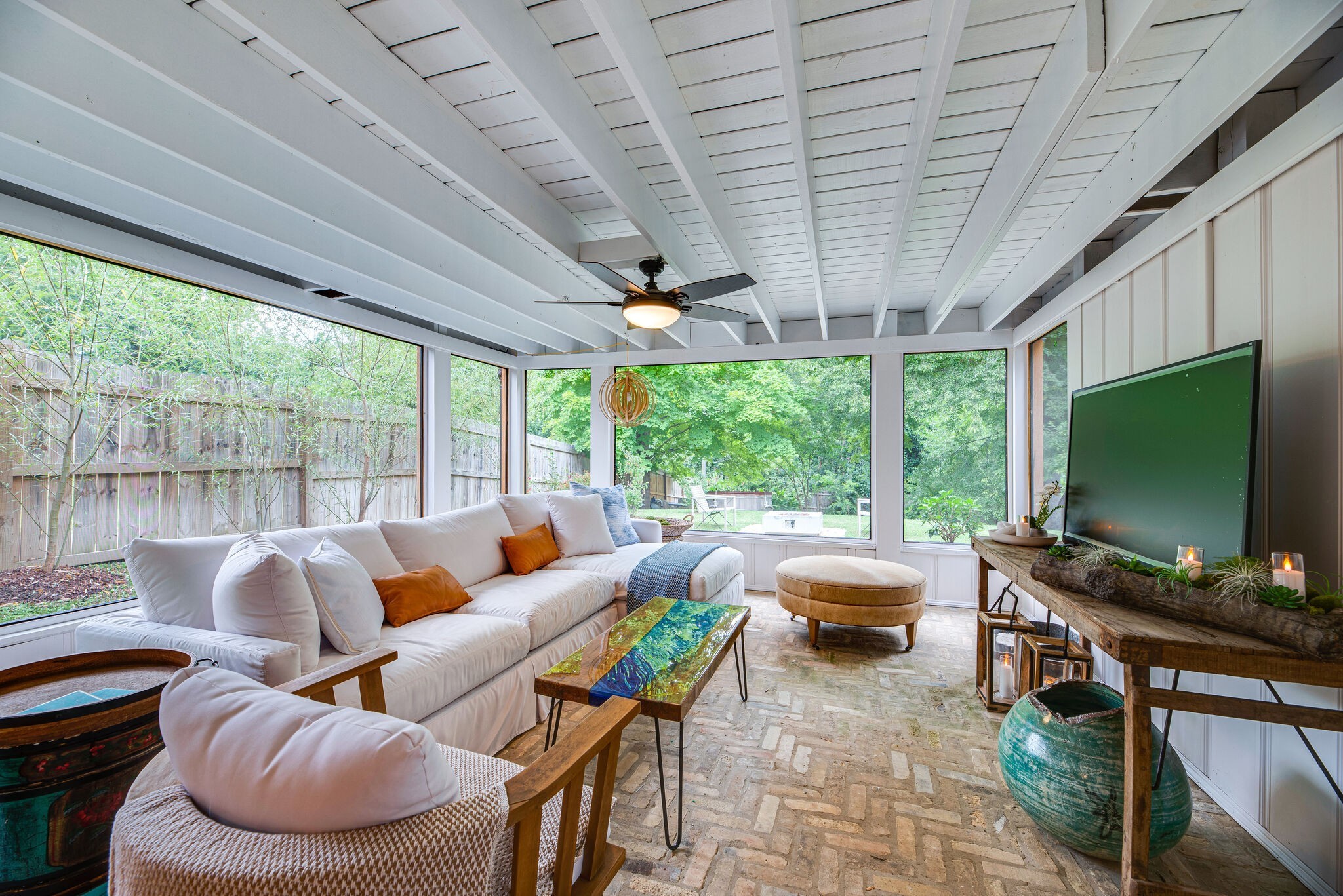 1715 Holly Street Nashville, TN 37206 - Photo 39 of 54 a living room with furniture a flat screen tv and floor to ceiling windows