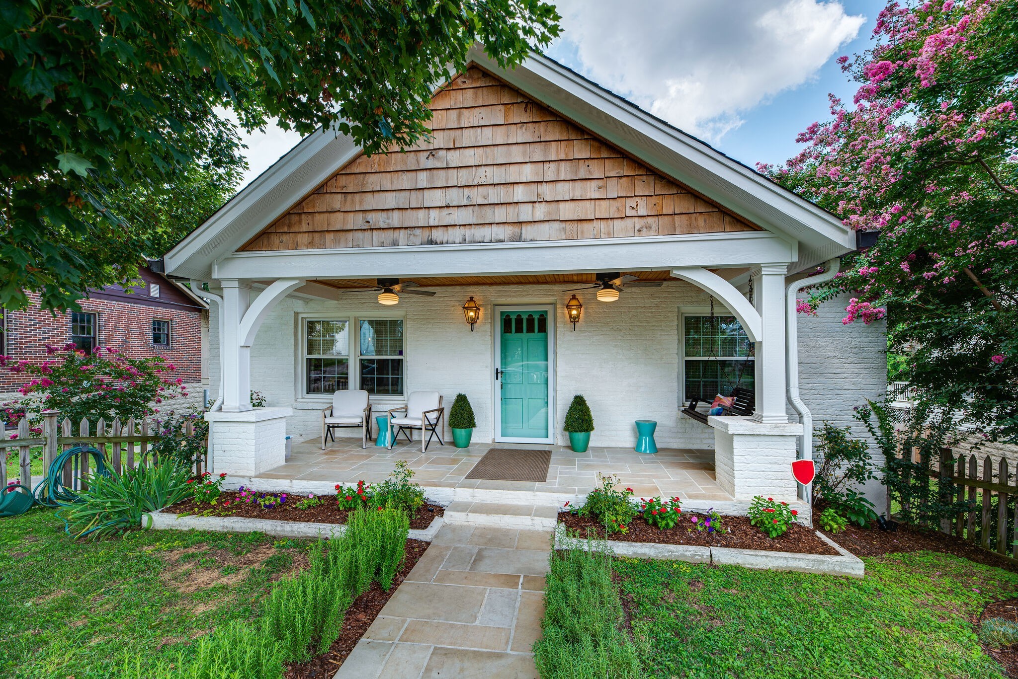 1715 Holly Street Nashville, TN 37206 - Photo 5 of 54 a front view of a house with fountain and potted plants