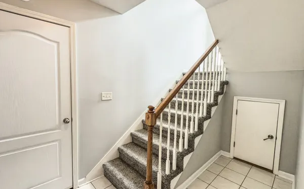 a bathroom with a sink mirror and toilet