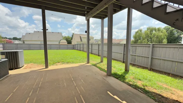 a view of a backyard with a garden