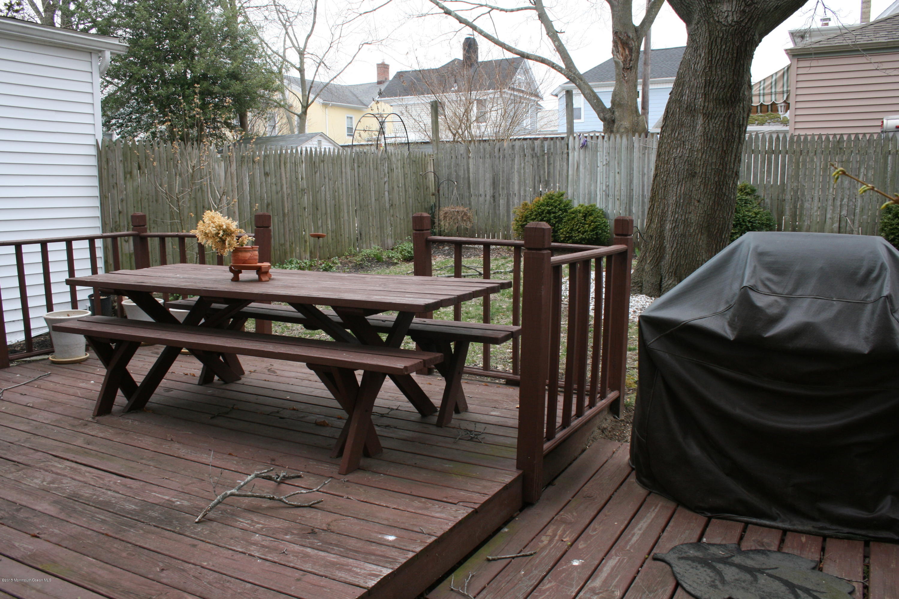 42 Spring Street Red Bank, NJ 07701 - Photo 24 of 24 a view of a dinning table and chairs on the roof deck