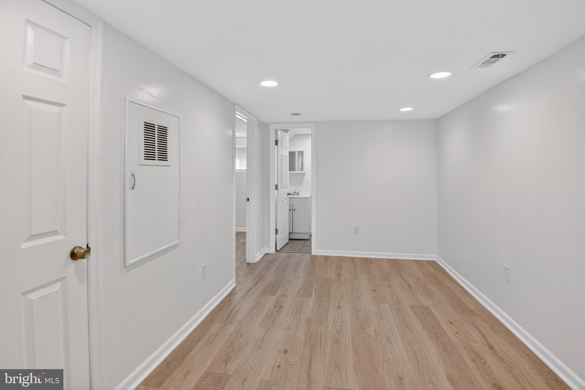 141 Uhland Terrace Northeast Washington, DC 20002 - Photo 11 of 16 a view of a hallway with wooden floor