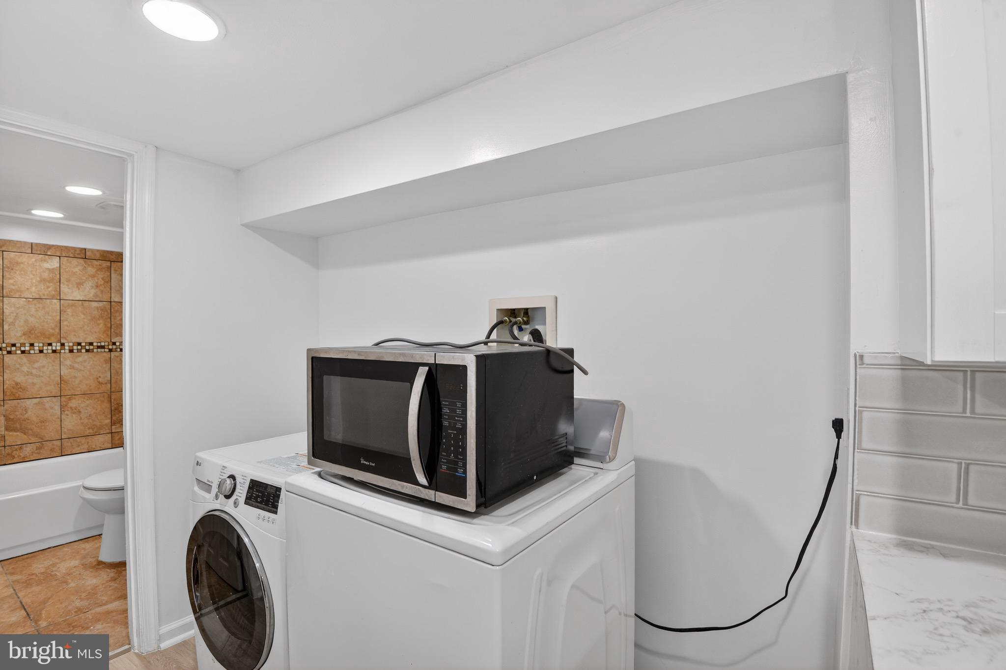141 Uhland Terrace Northeast Washington, DC 20002 - Photo 8 of 16 a utility room with dryer and washer