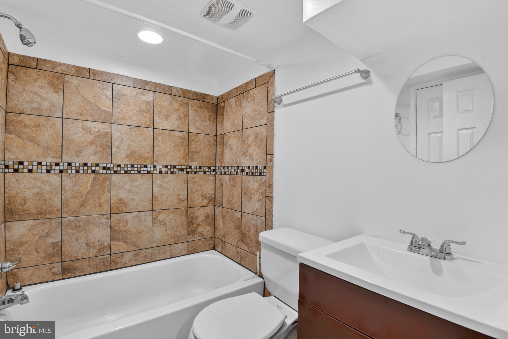 141 Uhland Terrace Northeast Washington, DC 20002 - Photo 9 of 16 a bathroom with a sink toilet and shower
