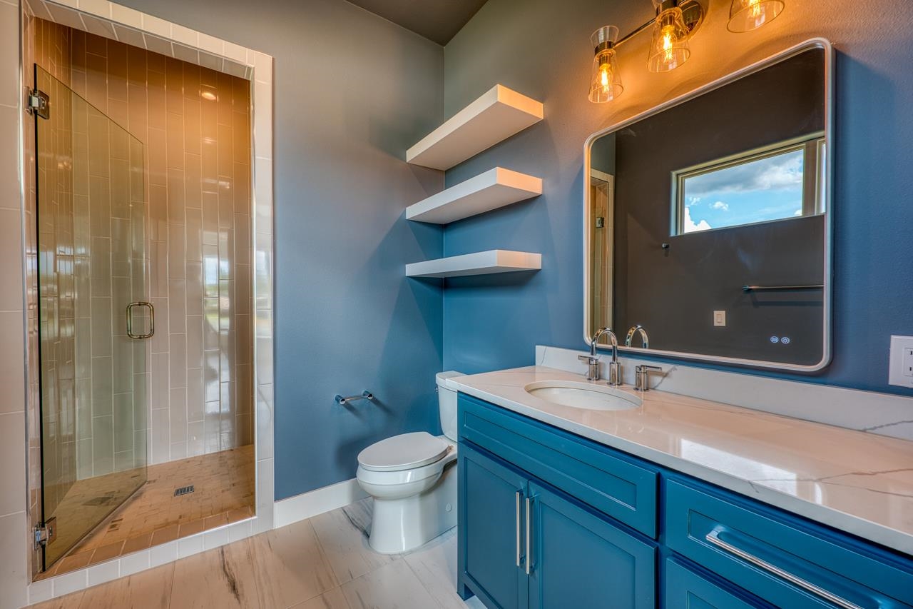 320 Lake Street Kingsland, TX 78639 - Photo 20 of 30 a bathroom with a sink a toilet and shower