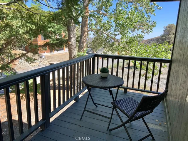 a view of a two chairs in the balcony