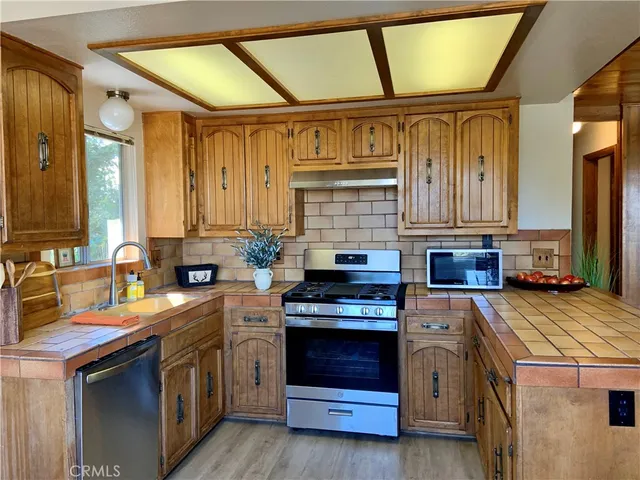 a kitchen with a stove and a sink