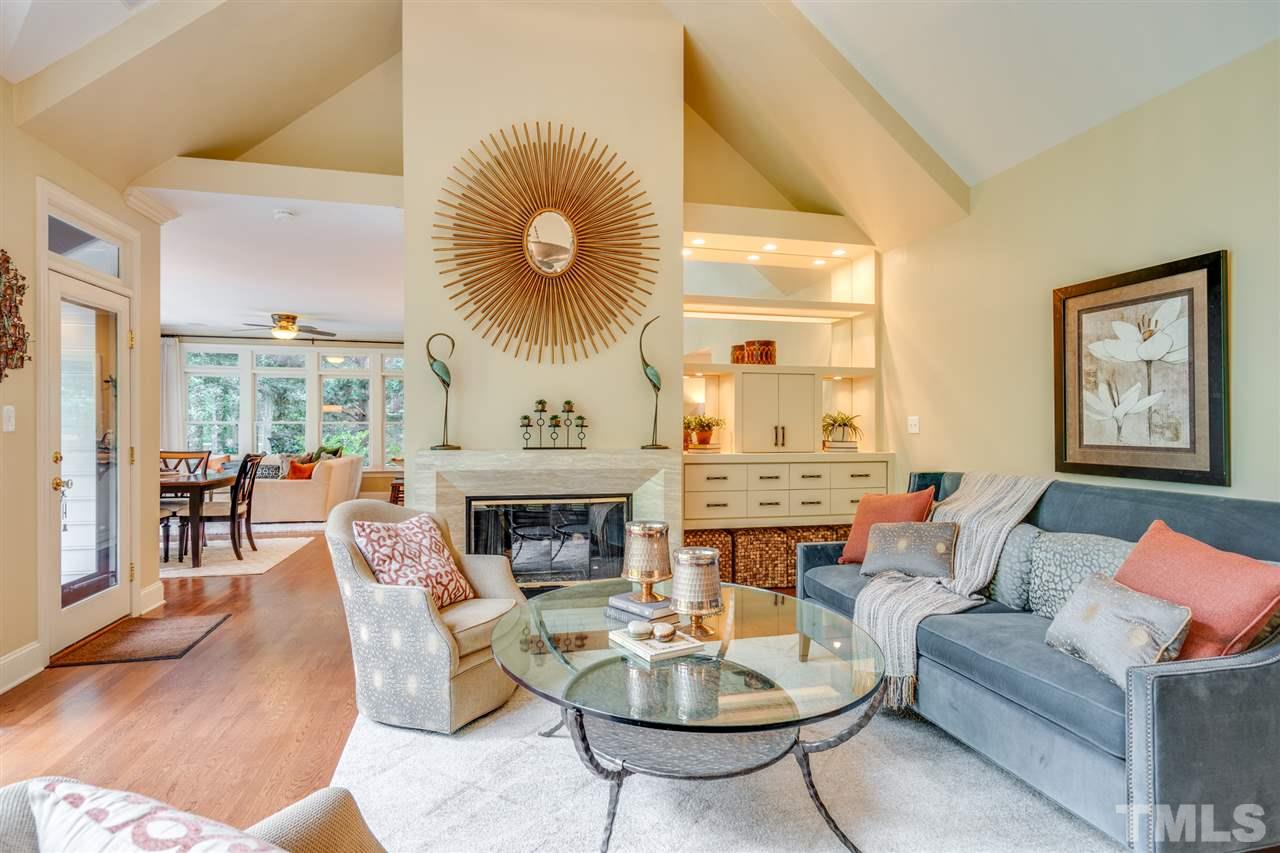 7604 Kelmscot Way Raleigh, NC 27615 - Photo 11 of 30 a living room with furniture and a fireplace