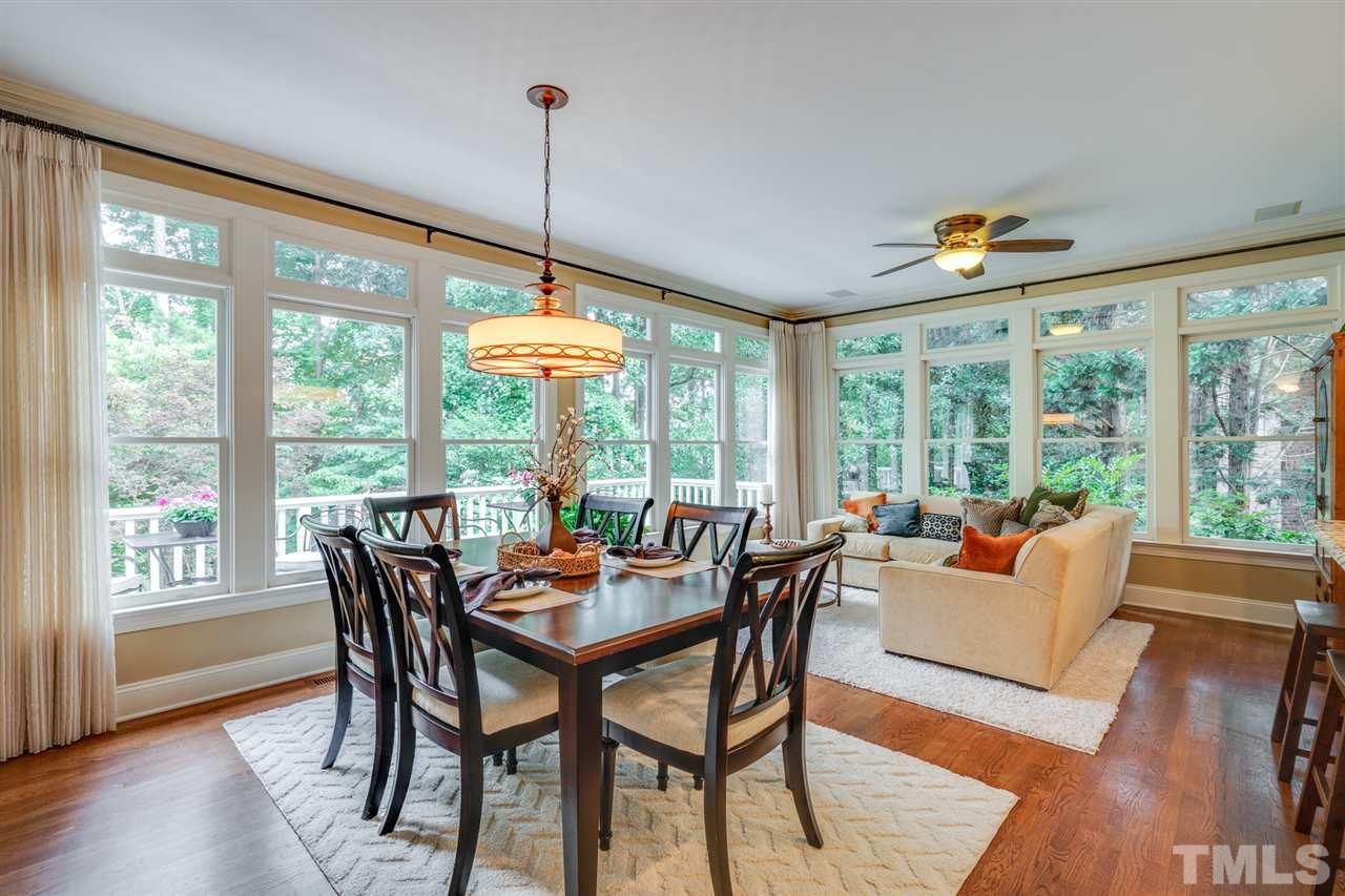 7604 Kelmscot Way Raleigh, NC 27615 - Photo 15 of 30 a view of a dining room with furniture window and wooden floor