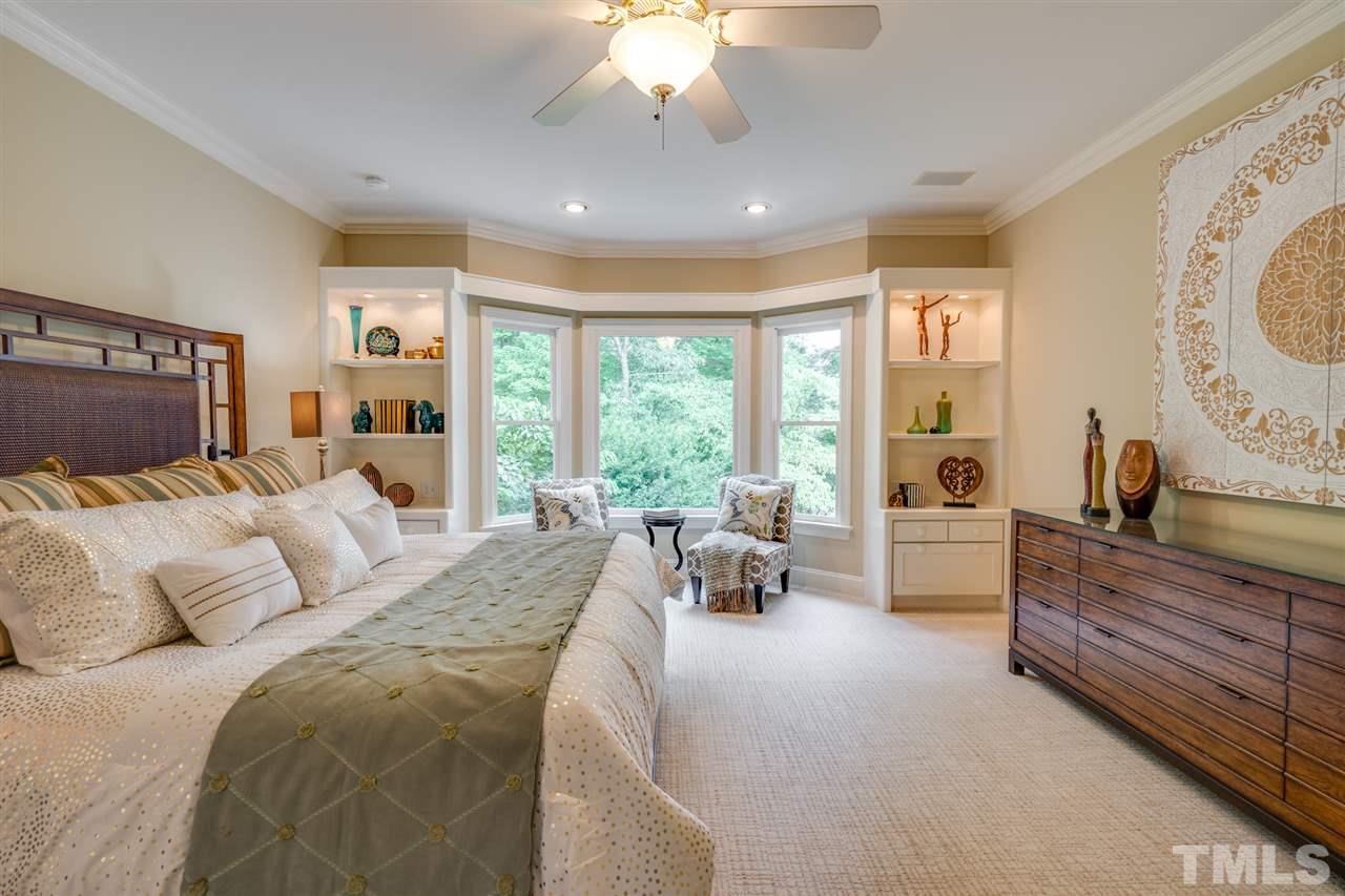 7604 Kelmscot Way Raleigh, NC 27615 - Photo 18 of 30 a bed room with a bed and furniture
