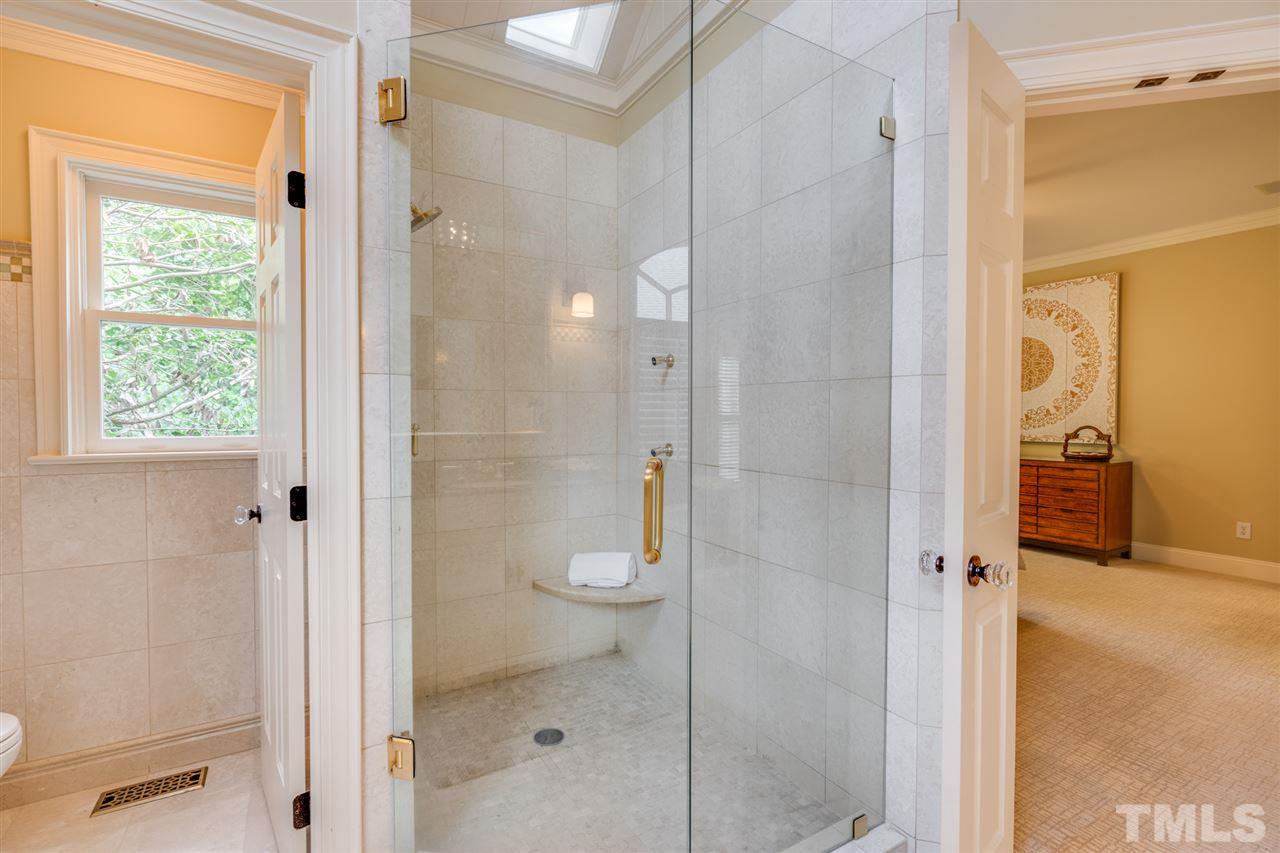 7604 Kelmscot Way Raleigh, NC 27615 - Photo 20 of 30 a bathroom with a shower and a sink