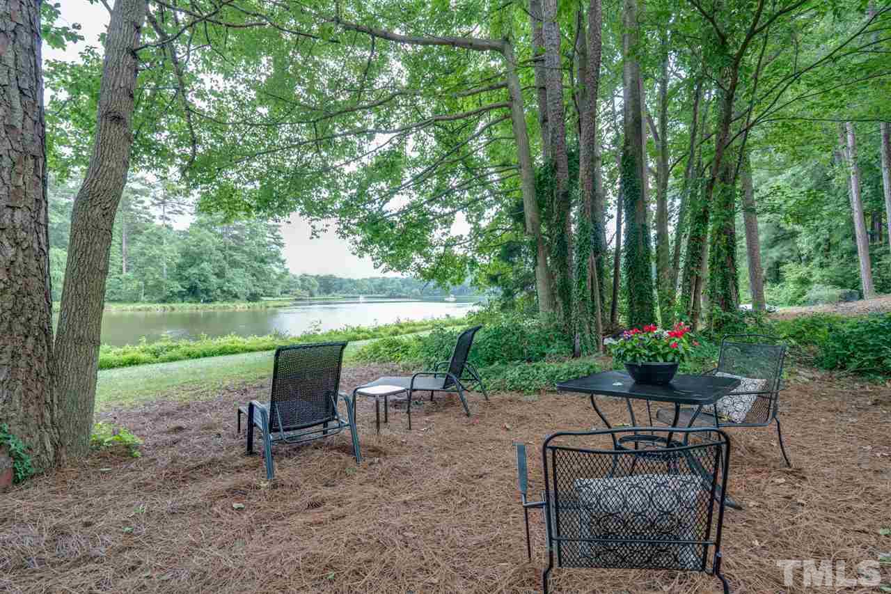 7604 Kelmscot Way Raleigh, NC 27615 - Photo 3 of 30 a view of a table and chairs in the garden