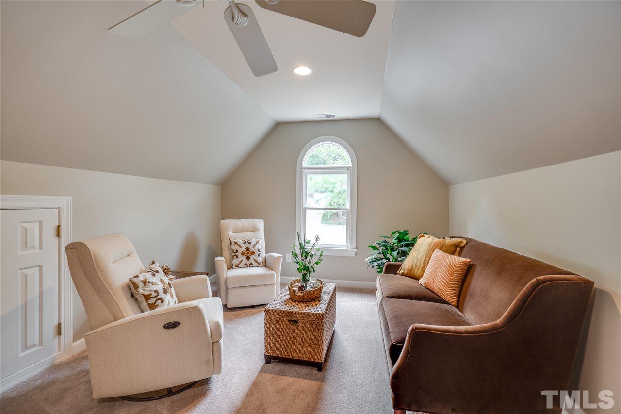 7604 Kelmscot Way Raleigh, NC 27615 - Photo 23 of 30 a living room with furniture and a large window