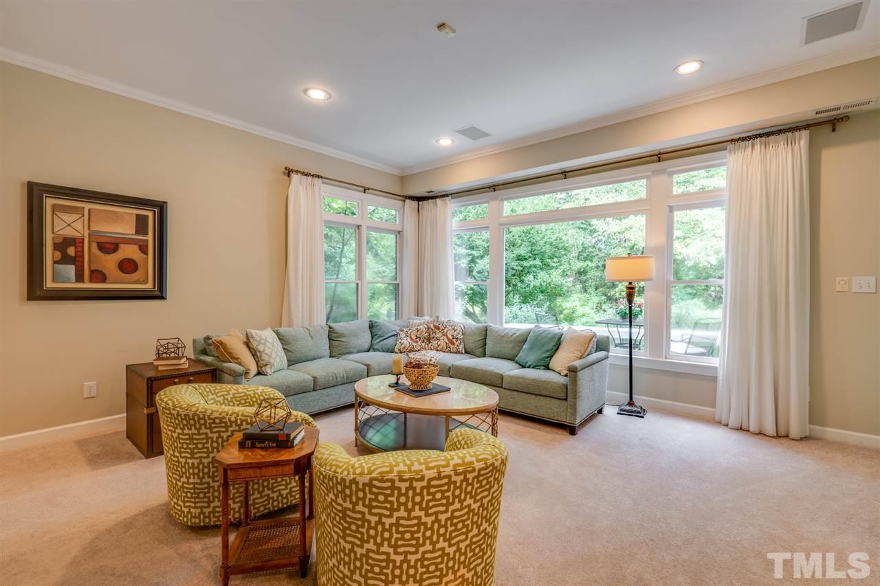 7604 Kelmscot Way Raleigh, NC 27615 - Photo 24 of 30 a living room with furniture and a large window