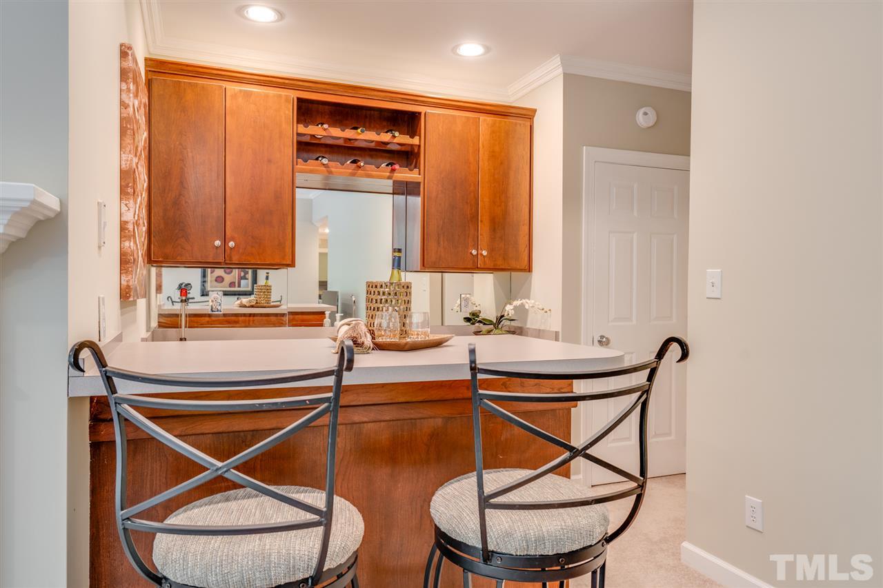 7604 Kelmscot Way Raleigh, NC 27615 - Photo 25 of 30 a room with a table and a glass door