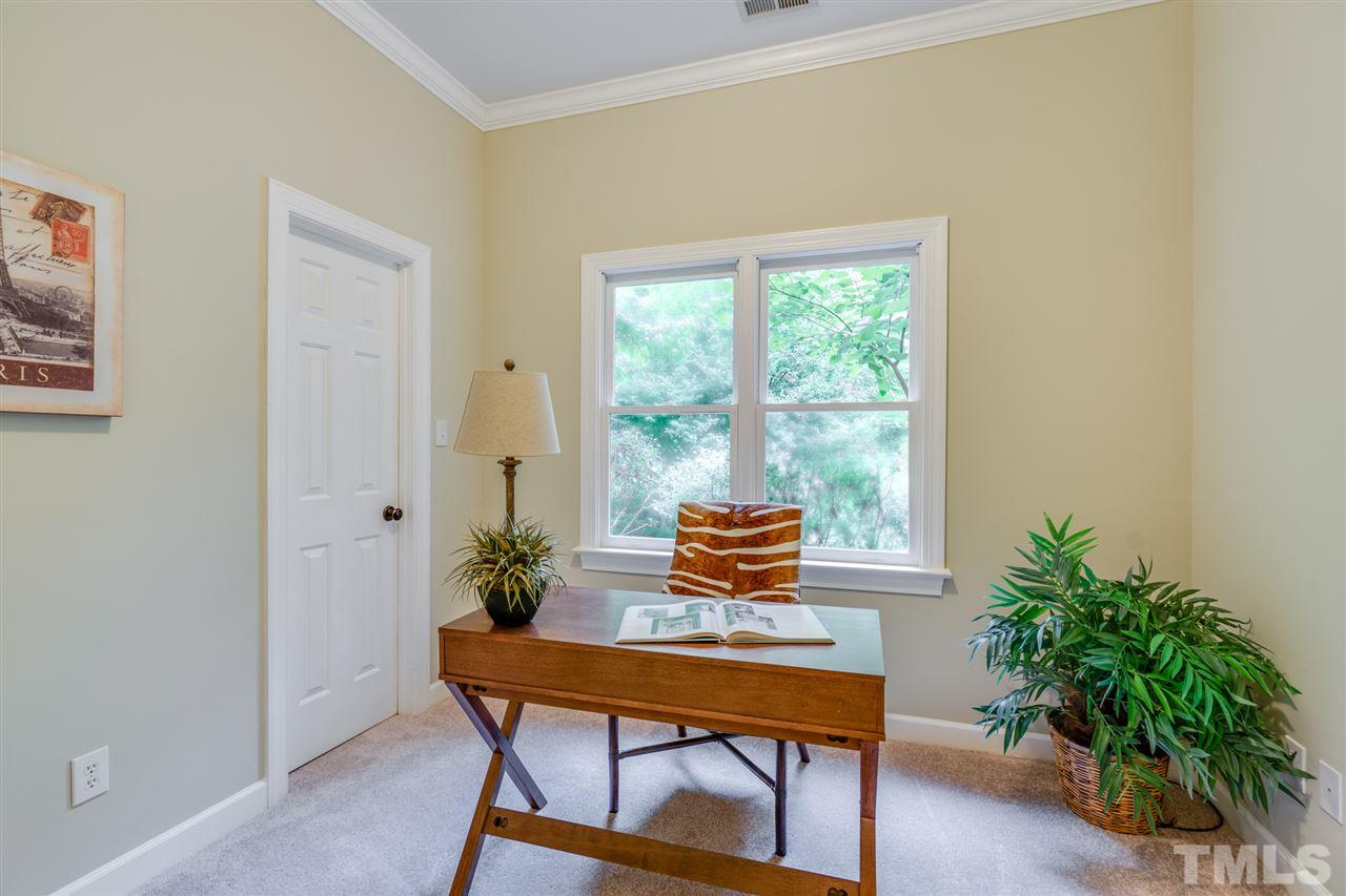 7604 Kelmscot Way Raleigh, NC 27615 - Photo 26 of 30 a living room with furniture and a potted plant