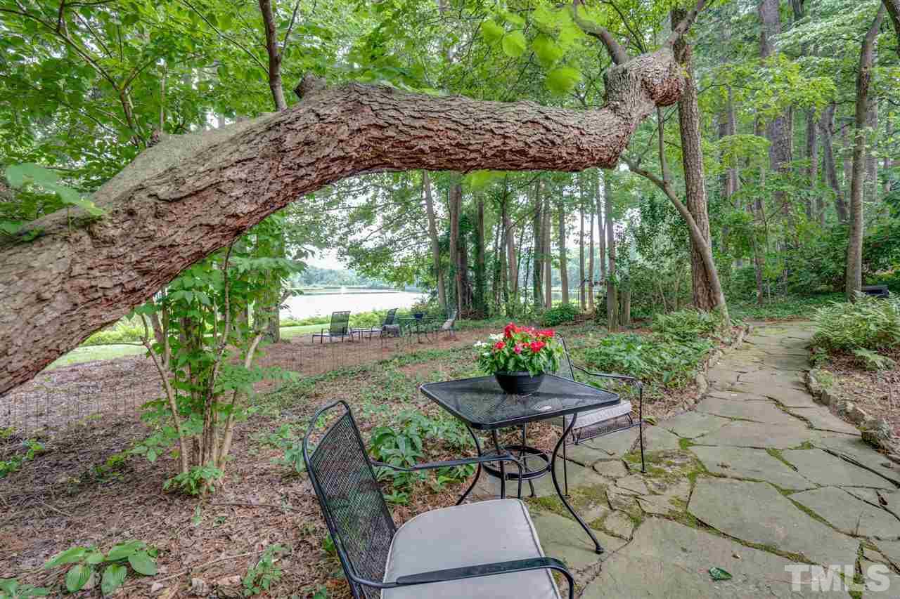 7604 Kelmscot Way Raleigh, NC 27615 - Photo 4 of 30 a view of a chairs and table in backyard