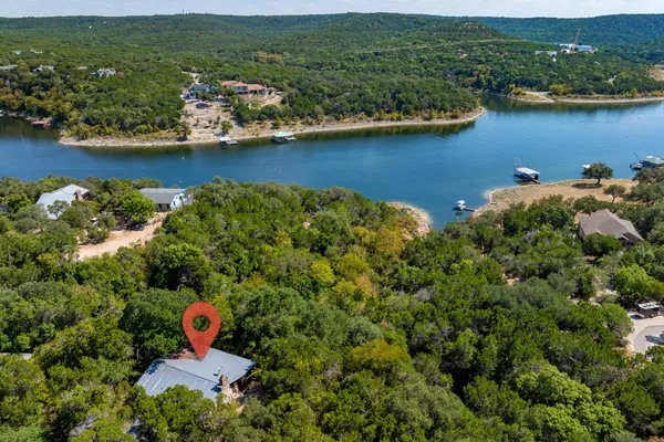an aerial view of a house with a lake view