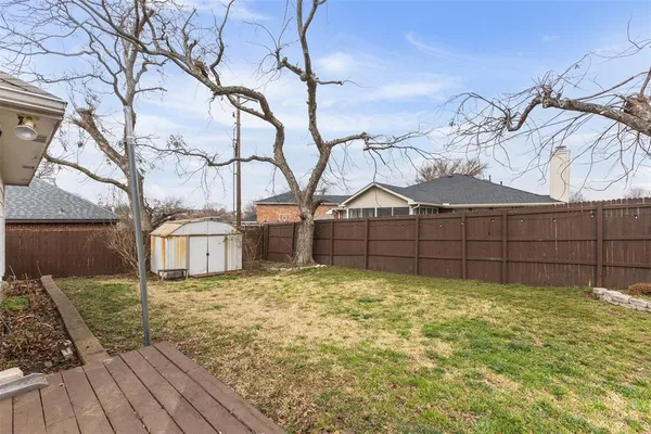 a view of a backyard of the house