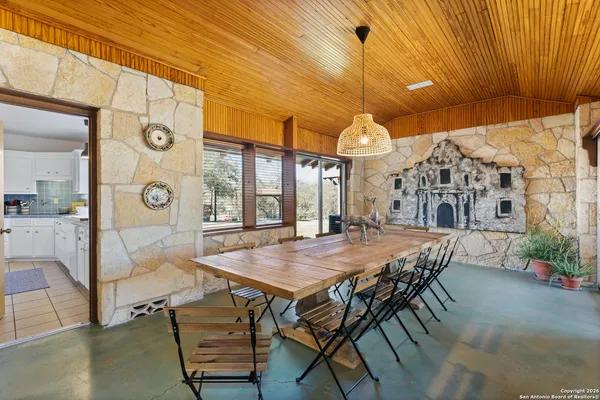 a view of a table and chairs in the patio
