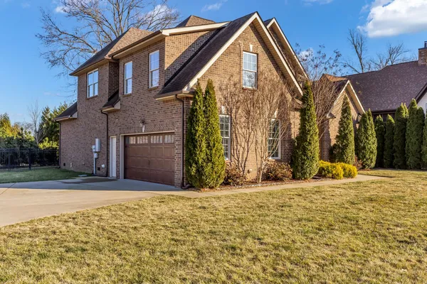 a view of a house with basketball court