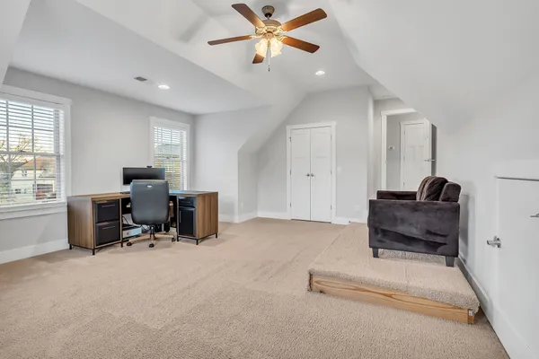 a bedroom with furniture and a window