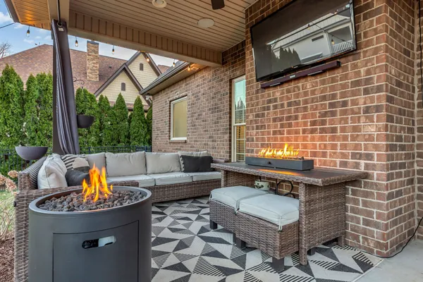 a view of a patio with a table and chairs
