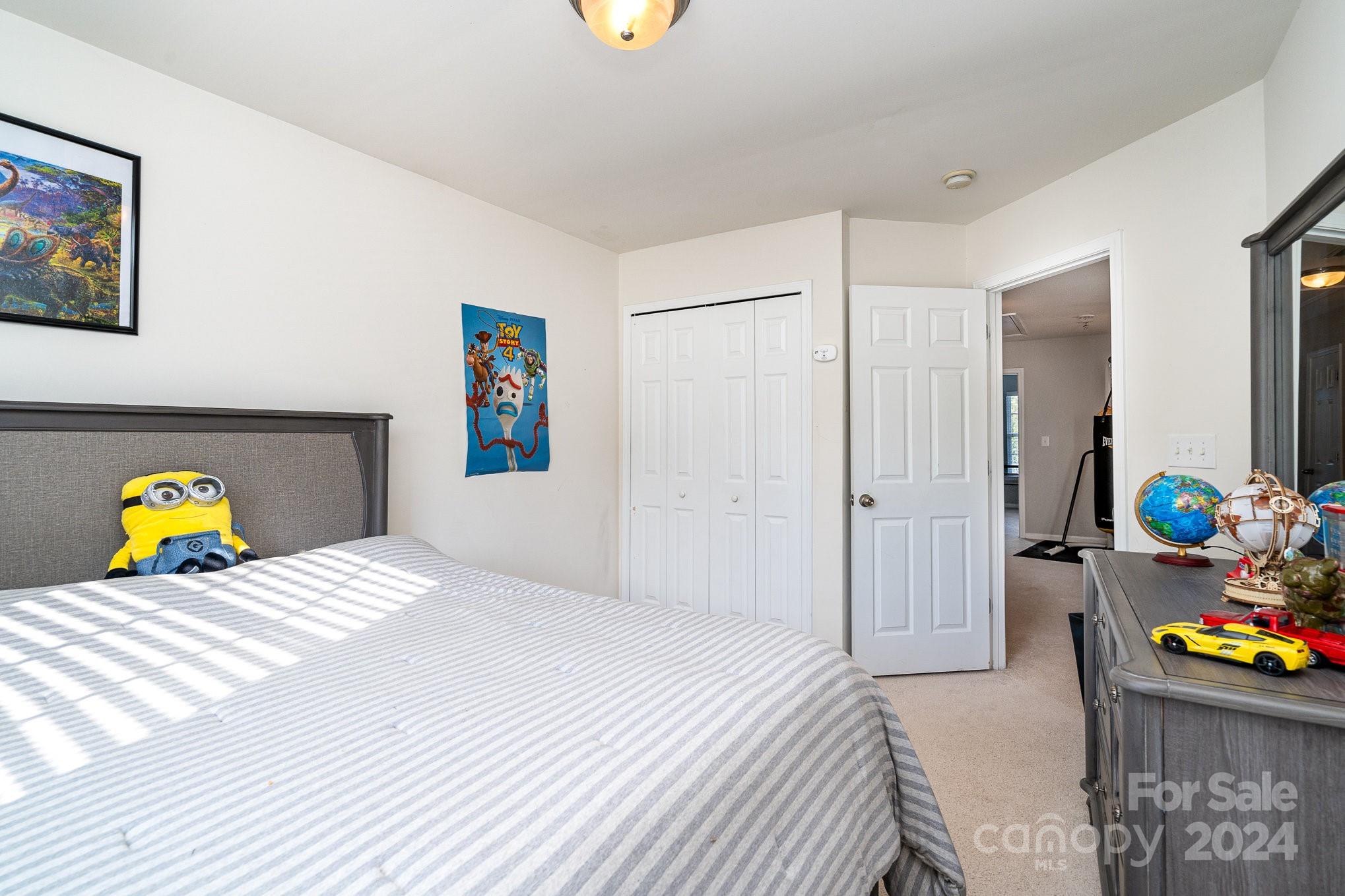 3367 Streamside Drive Davidson, NC 28036 - Photo 19 of 35 a bedroom with bed and a couch