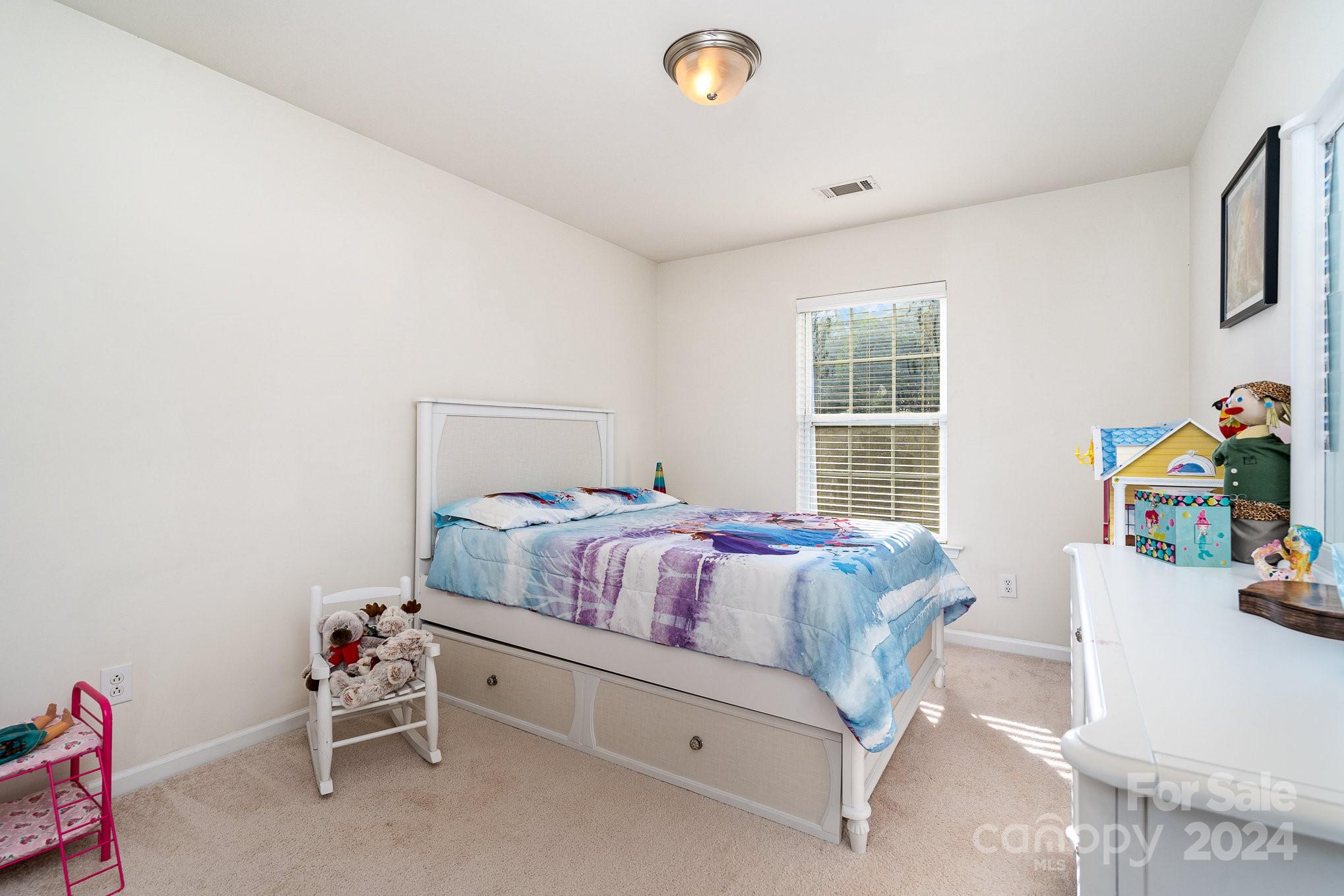 3367 Streamside Drive Davidson, NC 28036 - Photo 20 of 35 a bedroom with a bed and a window
