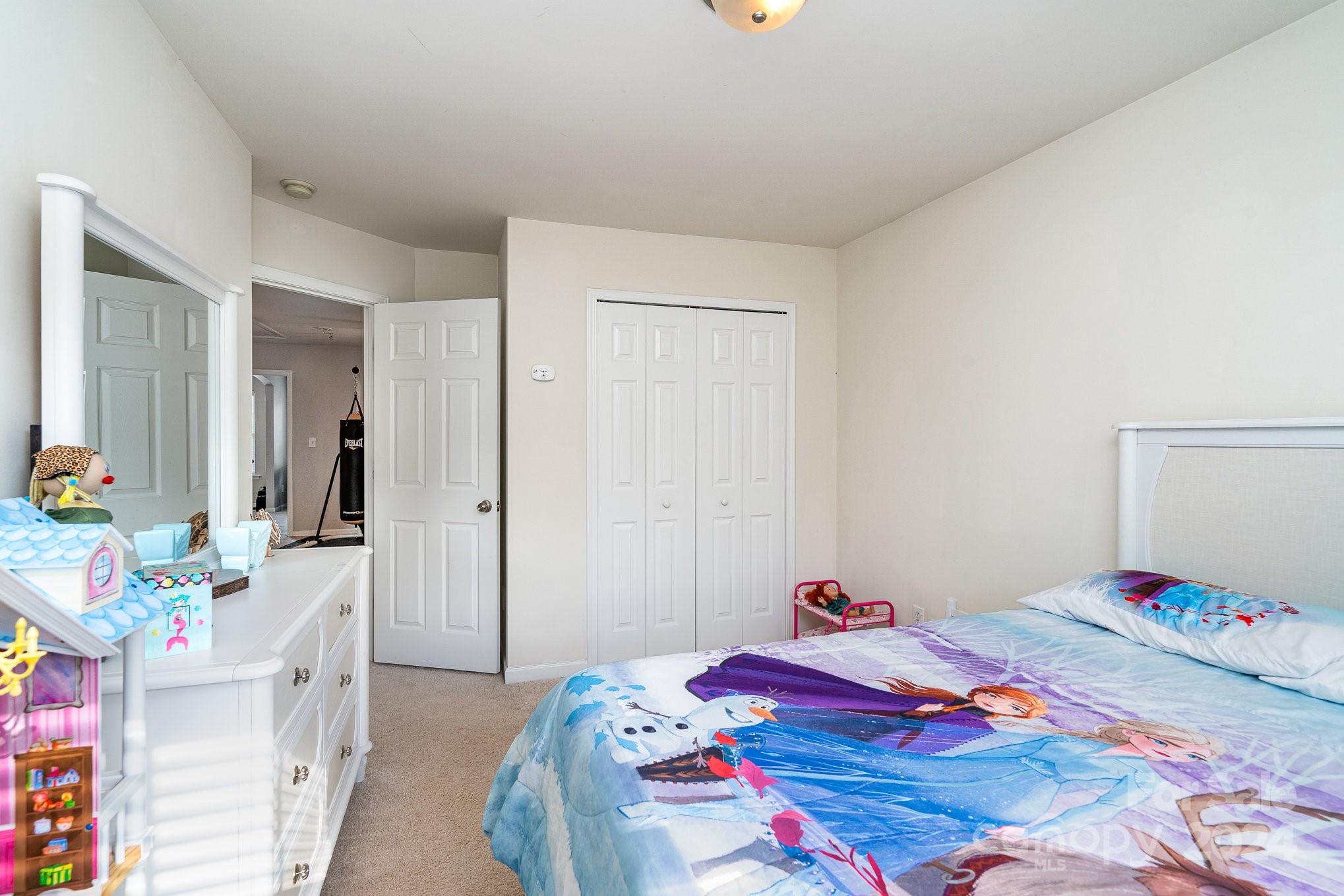3367 Streamside Drive Davidson, NC 28036 - Photo 21 of 35 a bedroom that has a bed and a dresser in it