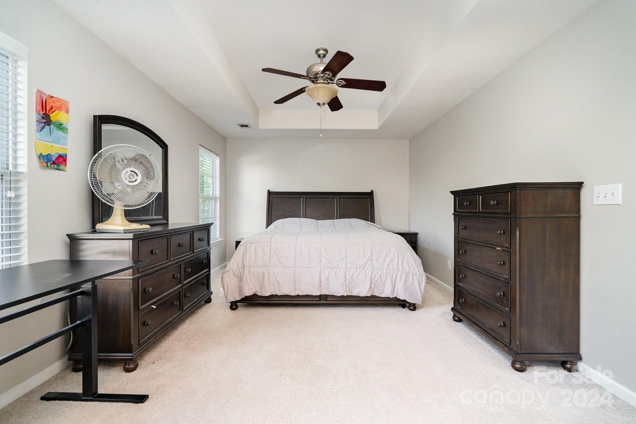 3367 Streamside Drive Davidson, NC 28036 - Photo 25 of 35 a bedroom with a bed and cabinets