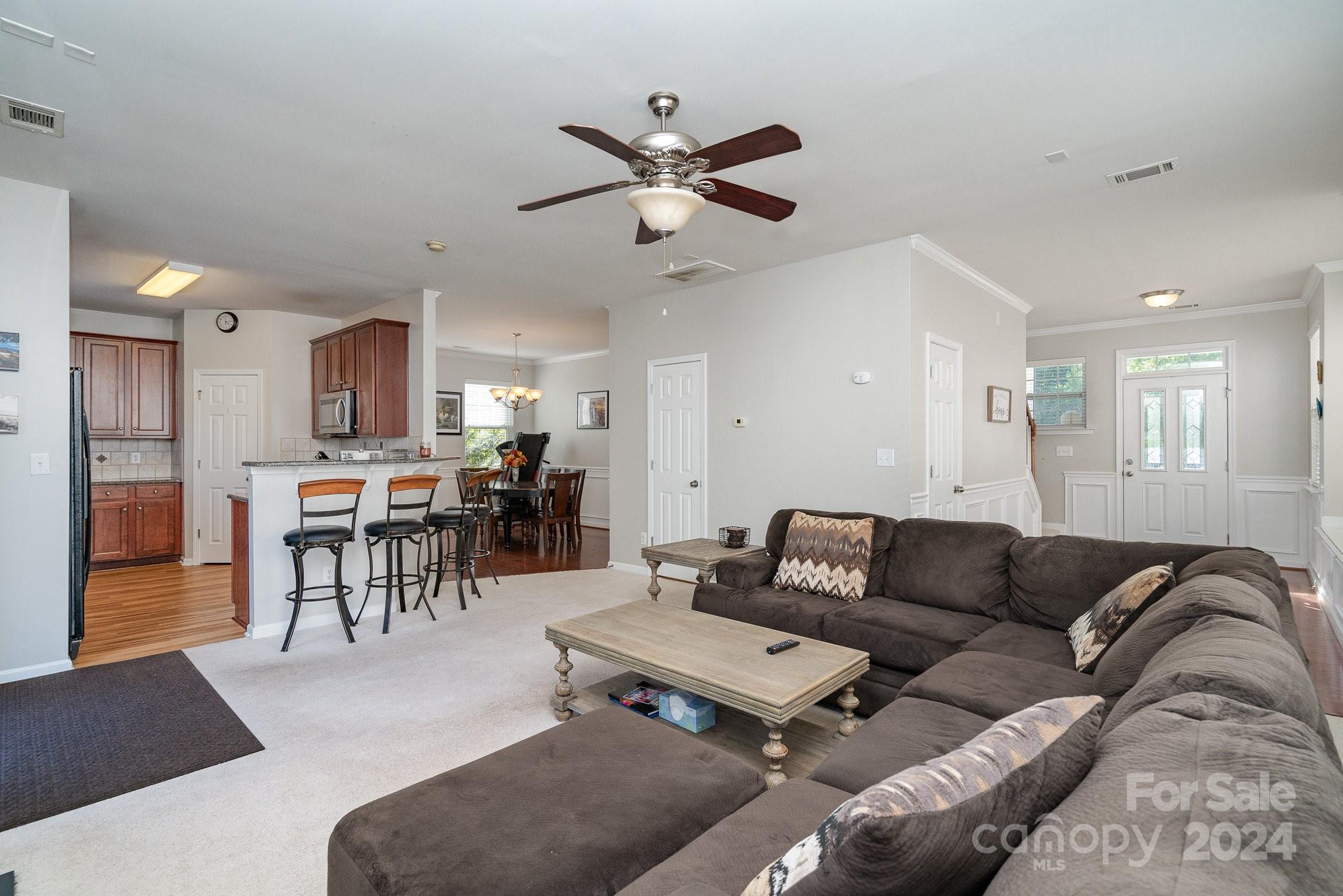 3367 Streamside Drive Davidson, NC 28036 - Photo 10 of 35 a living room with furniture and kitchen view