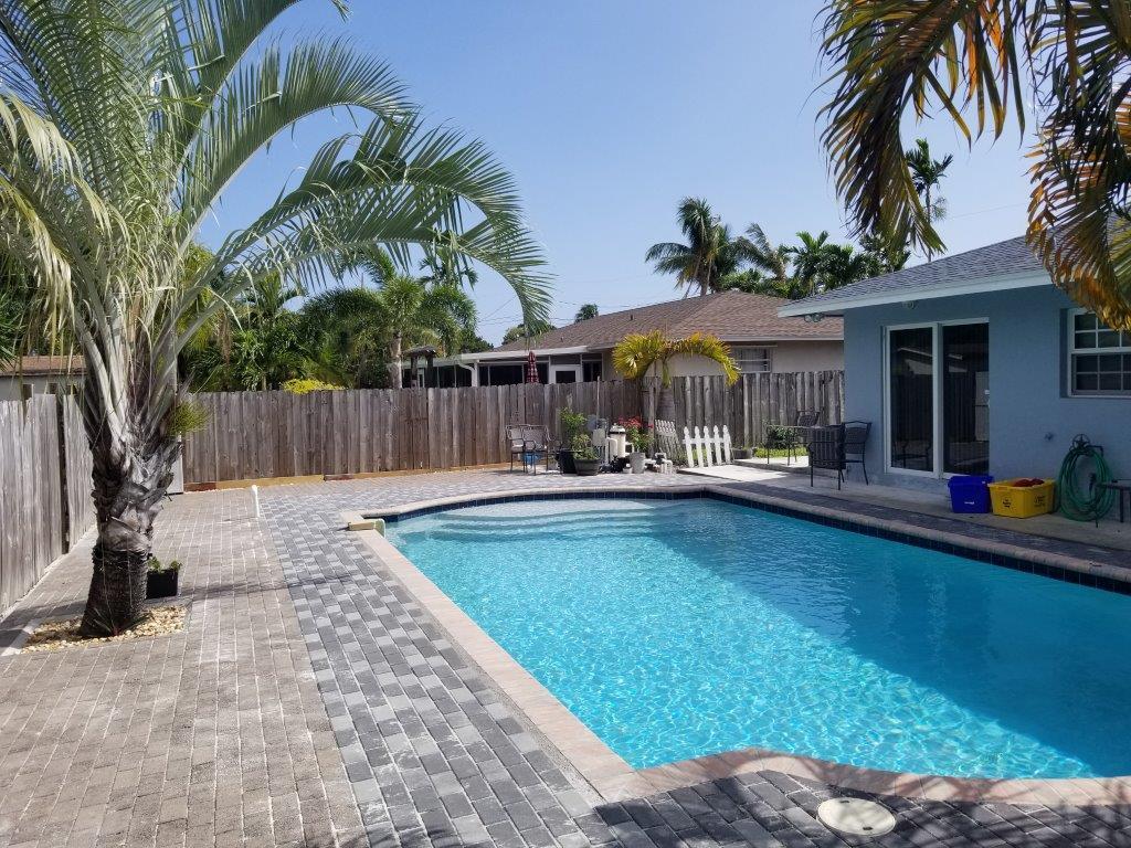 2855 Floral Road Lake Worth, FL 33462 - Photo 6 of 19 a view of a swimming pool with a patio