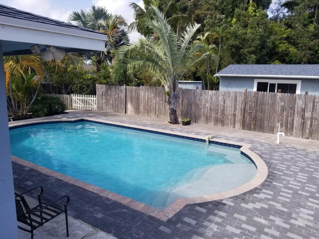 2855 Floral Road Lake Worth, FL 33462 - Photo 7 of 19 a view of a backyard with a small cabin