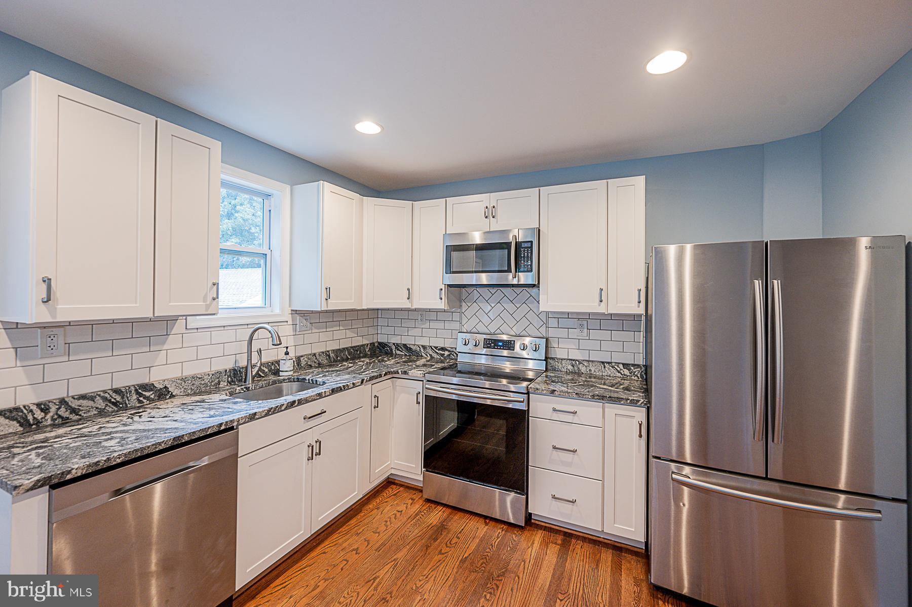 8606 Winands Road Randallstown, MD 21133 - Photo 23 of 42 Kitchen- Fresh Paint! Stainless Steel!